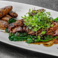 Flank Steak · Served oxtail and sauteed broccoli rabe with golden brown fingerling potatoes.