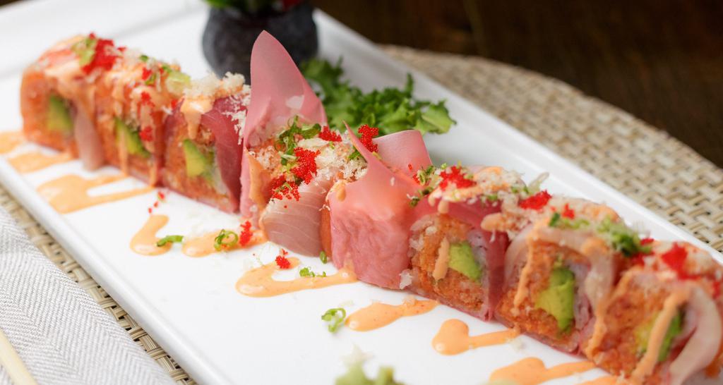Pink Lady Roll · (in) spicy tuna, salmon, yellowtail, avocado (top) salmon, tuna, yellowtail.