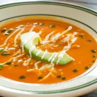 Sopa De Tortilla · Dairy. Tomato-guajillo soup, crispy tortilla, Mexican cheeses, crema, avocado