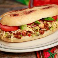 Pepito · Dairy and gluten. Mexican sandwich with choice of protein, black beans, guacamole, carameliz...