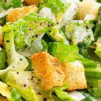 Classic Caesar · artisan romaine hearts, croutons, parmesan cheese, anchovies