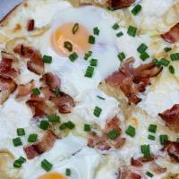 The Hangover · bacon, sunny side- up eggs, caramelized onions, mozzarella, parmigiana, mashed potatoes and ...