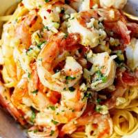 Shrimp Scampi With Linguini · White wine, butter lemon sauce.