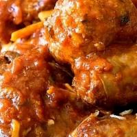 Sunday Gravy · A delicious combination of slow-cooked beef and pork short ribs, Mimmo's mom's meatballs and...