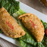 Empanadas (Argentinian Turnovers) · Beef, chicken, tomatoes, mozzarella, and basil, spinach.