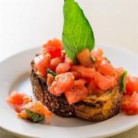 Bruscetta Di Pomodoro · Garlic toast topped with fresh tomato tossed in olive oil, basil, and salt. 1 piece.