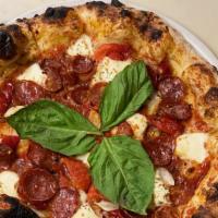 Pizza Diavola · Salame piccante, roasted red peppers, marinara sauce, peperoncino calabrese peppers, garlic,...