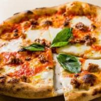 Pizza Salsiccia · Homemade sausage, tomatoes, mozzarella and wild fennel.