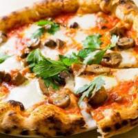 Pizza Funghi · Fresh mushrooms, tomato, mozzarella and parsley.