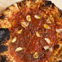 Pizza Marinara · Vine ripe tomatoes, sliced garlic, oregano, extra virgin olive oil and a little pepperoncino.