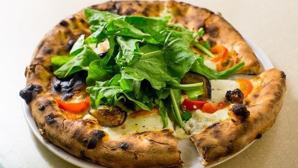 Goat Cheese Pizza · Mozzarella, goat cheese, roasted peppers, roasted eggplant, and arugula.