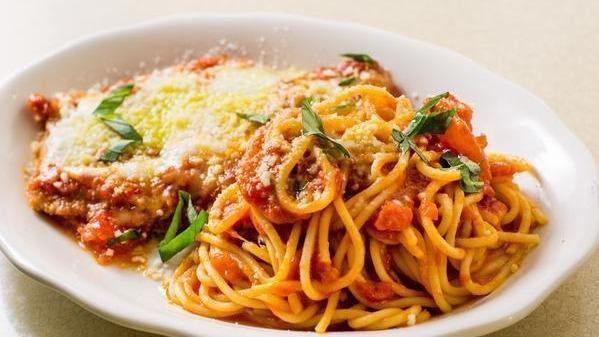 Chicken Alla Parmigiana · Breaded chicken cutlet with tomato basil, Parmigiano and fresh mozzarella and side of spaghetti pomodoro.
