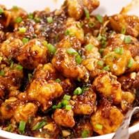 Crispy Gobi قرنبيط مقلي   · Batter deep fried cauliflower glazed with garlic chili sauce and sweet chili sauce