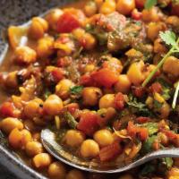 Chana Masala حمص   · Chickpeas, onion, tomato, garlic, ginger, cilantro, Indian spices. Served with rice