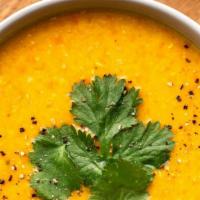 Lentil Soup · Yellow lentil, sizzling butter, garlic, ginger Arabic or Indian spices, Croutons