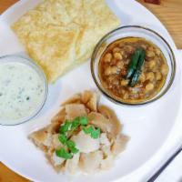 Halwa Puri And Chana  · Traditional breakfast