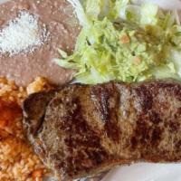 Carne Asada · Grilled marinated skirt steak with fresh guacamole, sautéed onions, and jalapeños. Served wi...