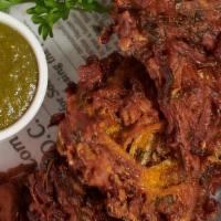 Mixed Pakora · Battered and fried onions / spinach, served with mint/tamarind chutneys.