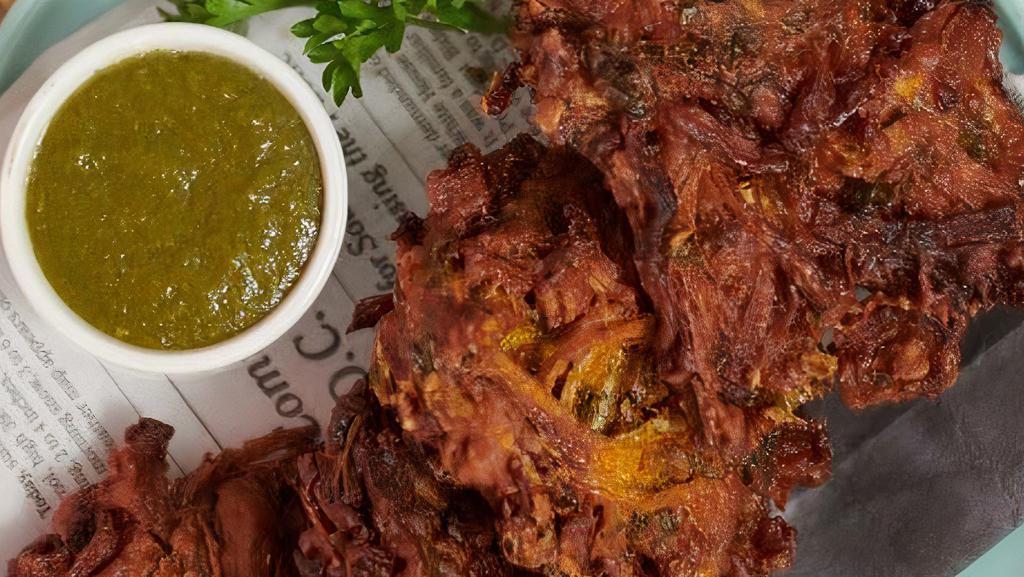 Mixed Pakora · Battered and fried onions / spinach, served with mint/tamarind chutneys.