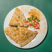 Quesadillas · Topped with melted cheese, sour cream, guacamole, pico de gallo, fried beans, a small side o...