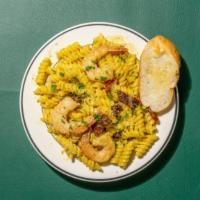 Creamy Pesto Pasta · Sundry tomatoes, pesto sauce and cream over routine pasta. Add chicken or shrimp for an addi...