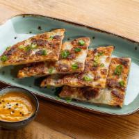 Quarter Stacks Of Scallion - Scallion Pancakes · Pan fried Chinese savory flat bread folded with scallions.
Served with yellow curry sauce.
C...