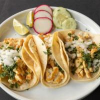 Tacos De Pollo Al Carbon · Grilled chicken breast, pico de gallo, avocado, queso fresco, served on homemade corn tortil...