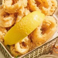 Crispy Calamari · Crispy batter-fried calamari, creamy seafood dipping sauce.