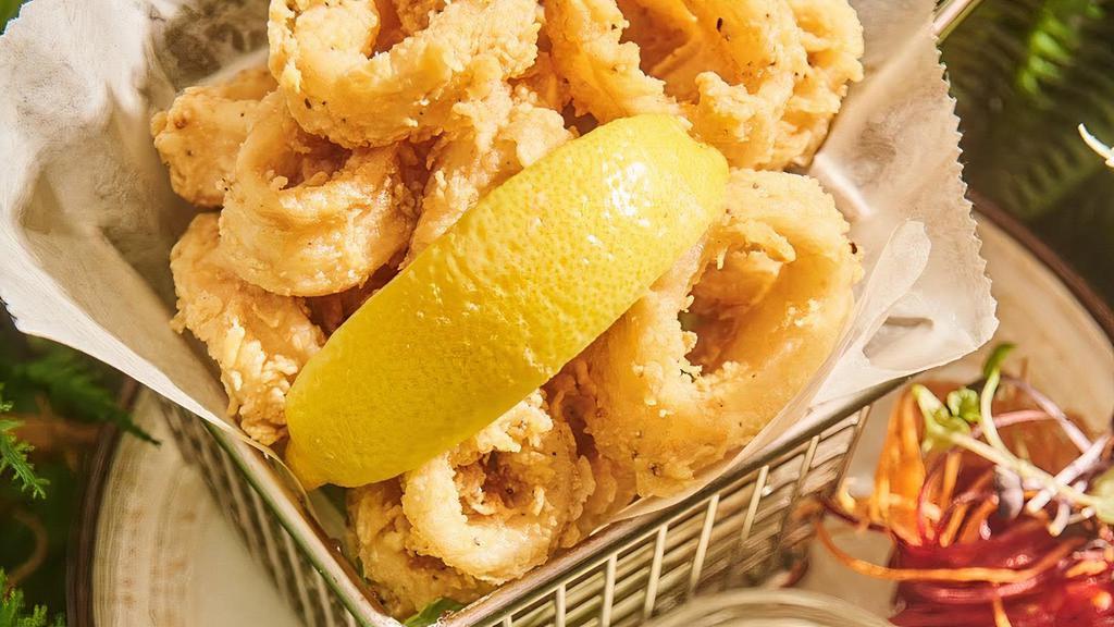 Crispy Calamari · Crispy batter-fried calamari, creamy seafood dipping sauce.