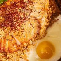 Salmon Stone Pot · Seared salmon, tom yum fried rice, egg.