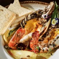 Giant River Prawns Green Curry · Spicy. Carrot, bell pepper, young coconut, basil leaves, served with toasted bread.