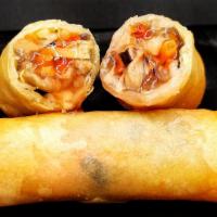 Spring Roll · Carrot, water chestnut, enoki mushroom, black agaric, bamboo shoots and mushroom. Two pieces.