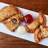 2 For 6 Philly Empanadas · Made per order and deeply fried Philly style steak or chicken turnovers filled with sautéed ...