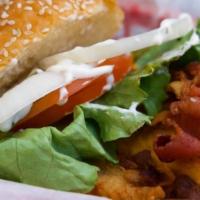 Chicken Bacon Ranch Wich' · Crispy fried chicken basted with ranch dressing topped with bacon, lettuce, tomato, raw onio...