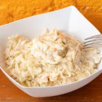 Coleslaw · Shredded raw cabbage and carrots in a mayo base dressing.