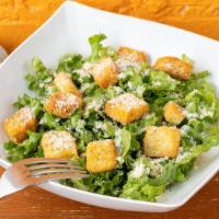 Large Caesar Salad · Caesar Salad lettuce, parmesan cheese and croutons with a side of caesar dressing.