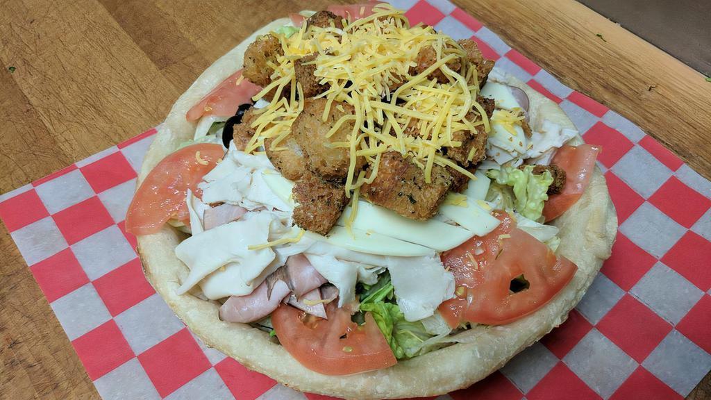 Julienne Bread Bowl Salad · Meat and cheese. Hand-tossed pizza dough freshly baked and filled with fresh lettuce, veggies and homemade croutons.
