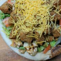 Marinated Chicken Bread Bowl Salad · Hand-tossed pizza dough freshly baked and filled with fresh lettuce, veggies and homemade cr...