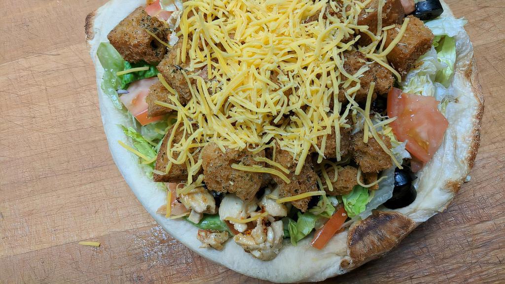 Marinated Chicken Bread Bowl Salad · Hand-tossed pizza dough freshly baked and filled with fresh lettuce, veggies and homemade croutons.