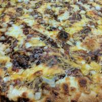 Chicken And Bacon Bbq Pizza · Topped with chicken, bacon, onions, cheddar and BBQ sauce.