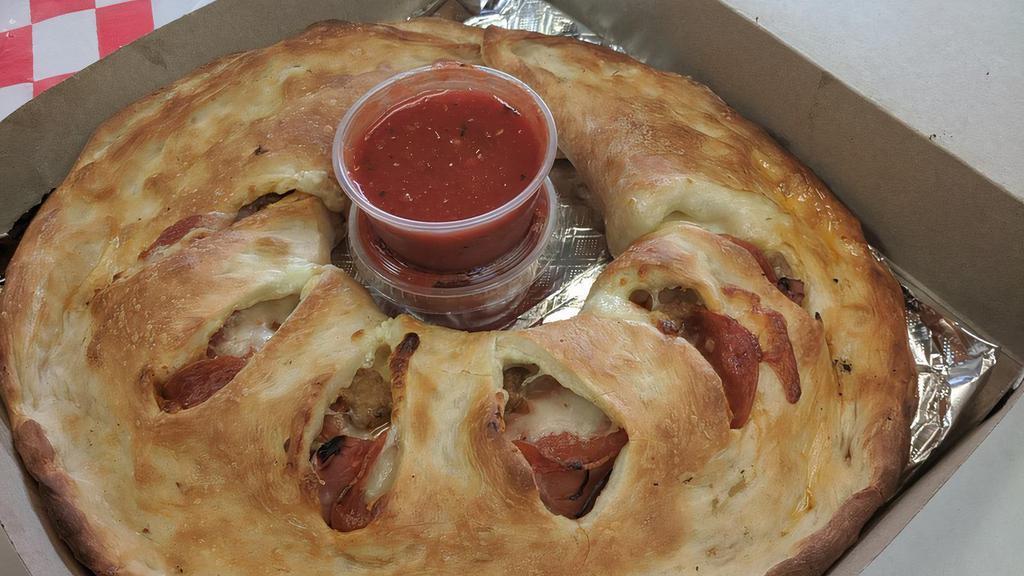Custom Calzone · Mozzarella, Romano cheese, ricotta cheese and your choice of ingredients. Includes 2 sides of pizza sauce.