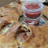 Meat Lover'S Calzone · Ham, Italian sausage, pepperoni, ricotta and mozzarella cheese. Includes 2 sides of pizza sa...
