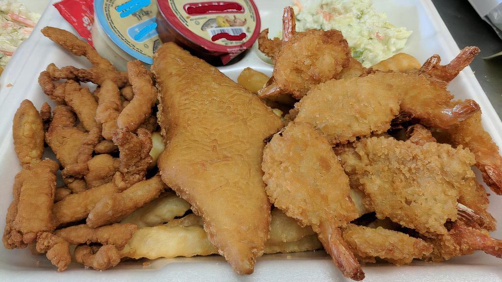 Seafood Combo · Served with fish, fried clams, shrimp, fries, tarter sauce, cocktail sauce and coleslaw.