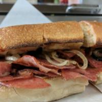 The Big Loretta Sub · Genoa salami, hot ham and provolone cheese, topped with special Italian olive salad, then ba...