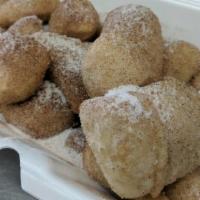 Cinnamon Toes · Homemade fried pizza dough, deep fried and covered with cinnamon and sugar.