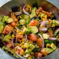 Cantina Insalata · Hearty Spring Mix, sliced avocado, onions, tomato sprinkled with corn and our home house-mad...