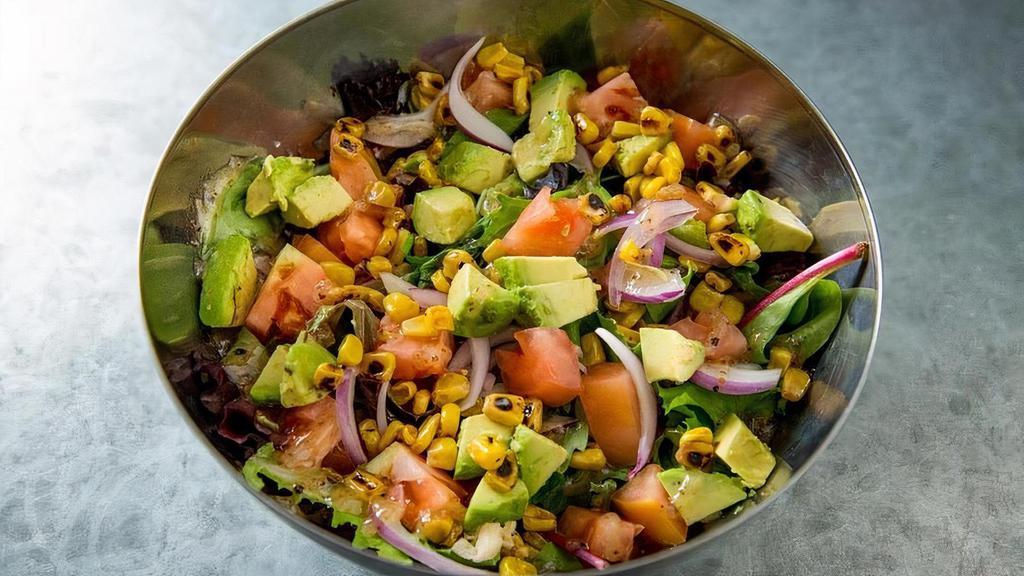 Cantina Insalata · Hearty Spring Mix, sliced avocado, onions, tomato sprinkled with corn and our home house-made Citrus dressing