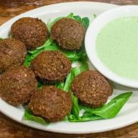 Falafel Platter · 7 pc. Blended chick peas, onions, garlic parsley, and spices formed into small rounds and li...