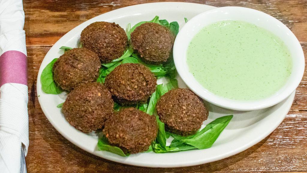 Falafel Platter · 7 pc. Blended chick peas, onions, garlic parsley, and spices formed into small rounds and lightly fried.