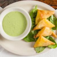 Pastels · Crispy phyllo dough filled with potatoes, herbs and spices.